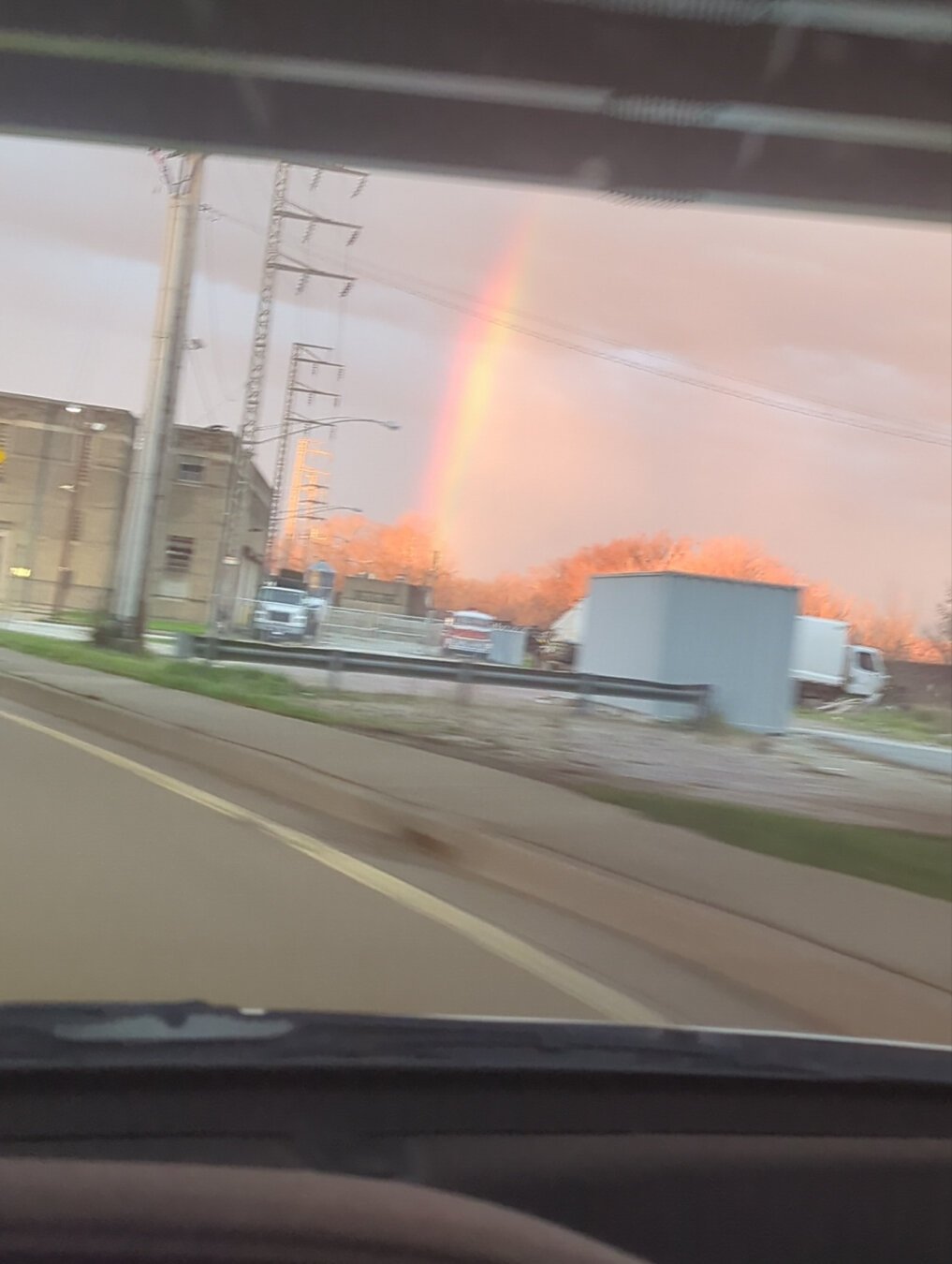 A blurry rainbow thru a car windshield on the way to work.