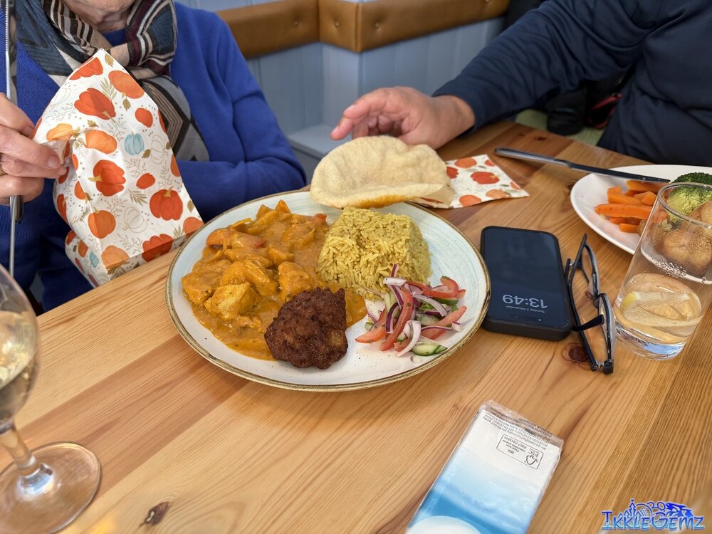 Chicken Tikka Masala with rice, onion bhaji, salad and a poppadom