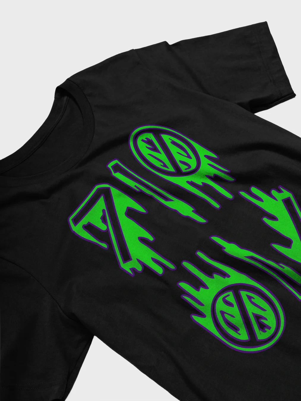 A closeup of the front of a black t-shirt with a creepy 710 OIL drip design. The numbers are bright green and outlined in purple.