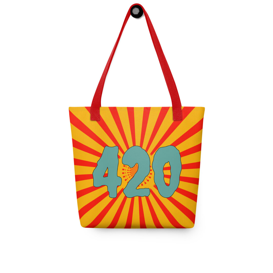 A tote bag with red handles and weird 420 art. The number 420 is light blue and surrounded by red and gold color circus stripes.