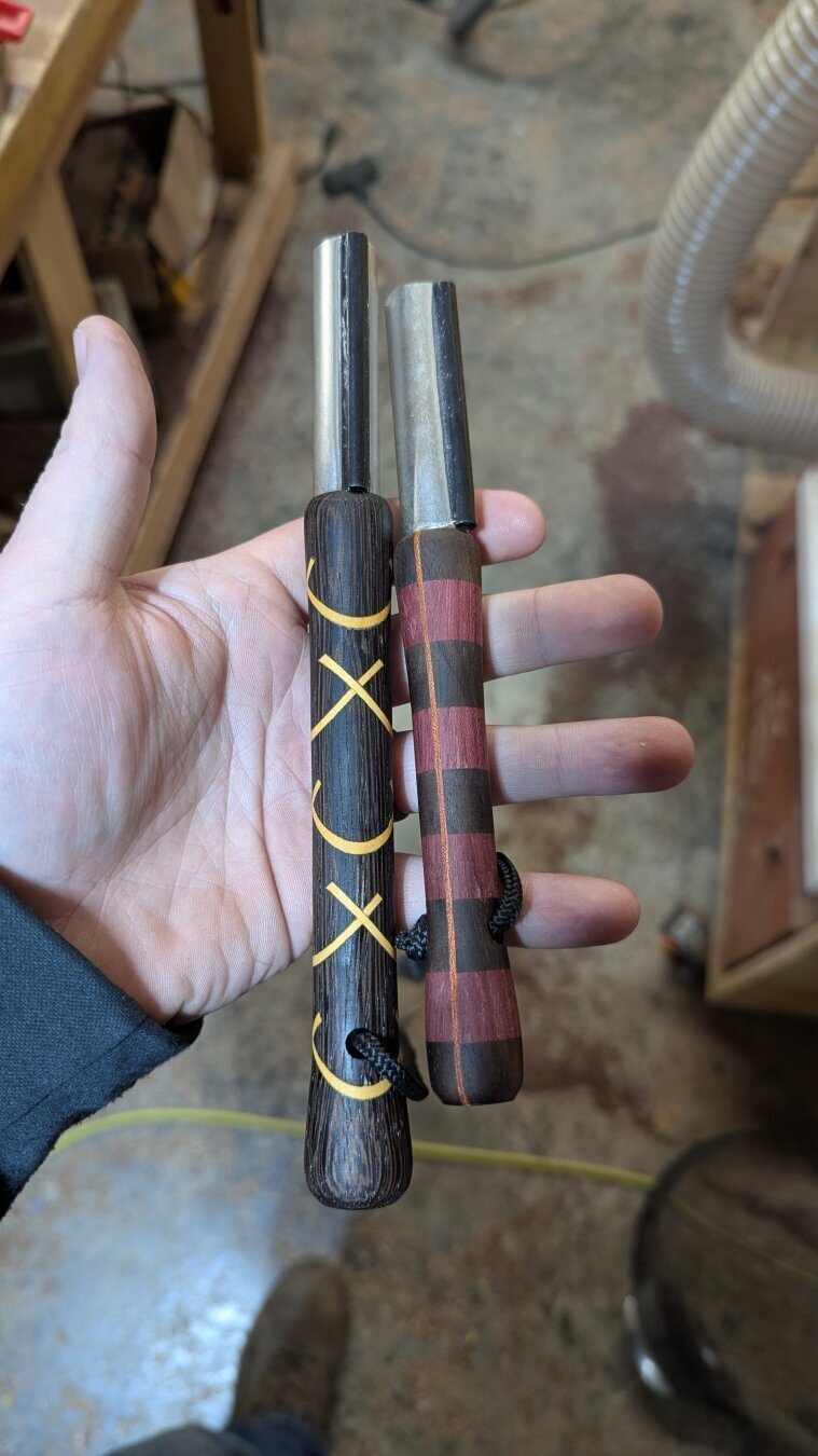 Two beautiful turned handle flint fire strikers