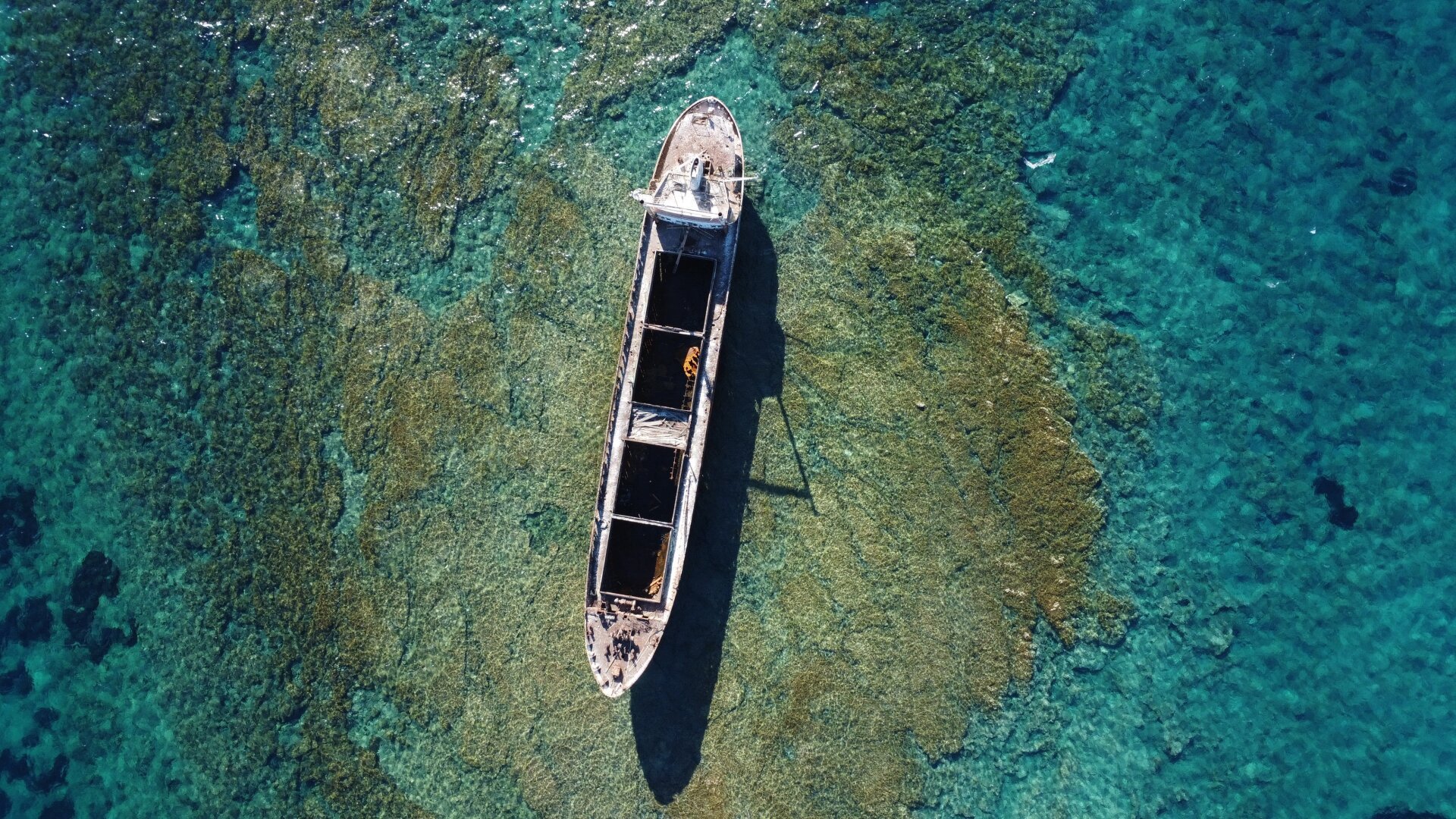 Shipwreck on a reef. Photographed from an arial drone