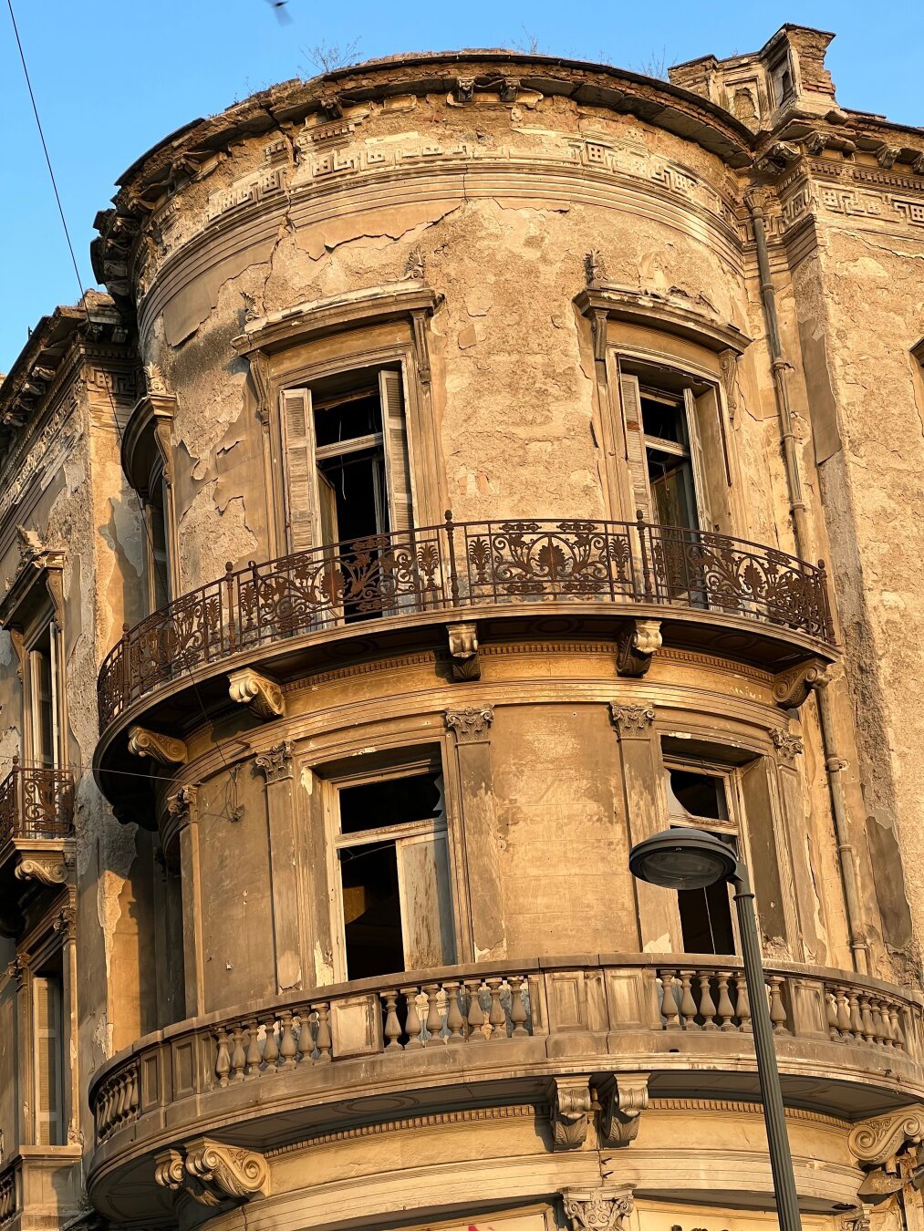 Old building with open windows in the evening light