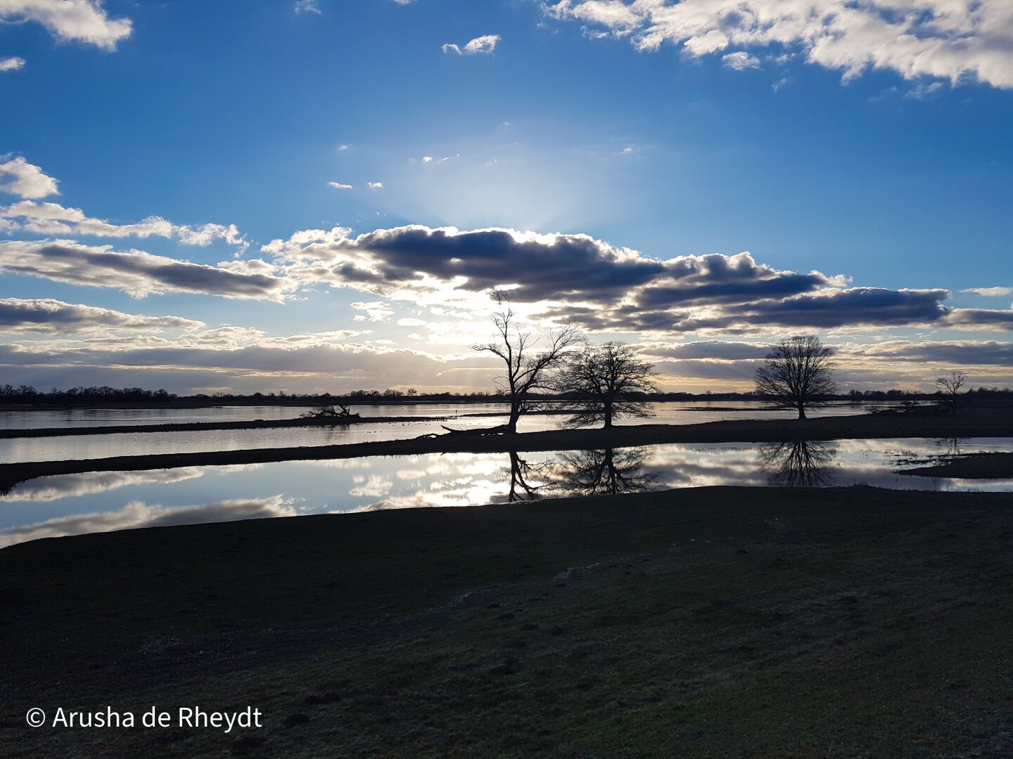 Blue sky with clouds mirtor in a calm river. Panoramic shot