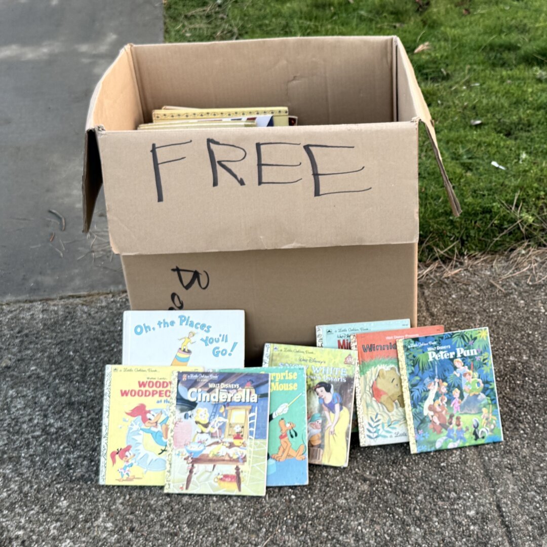 Box of Little Golden Books on the street marked FREE