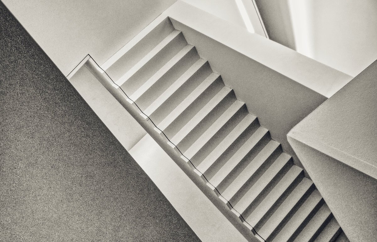 slightly disorientating monochrome photo of a stairwell