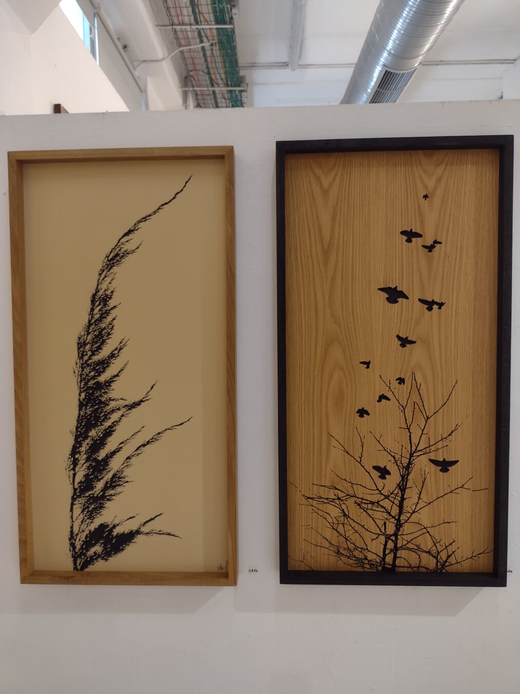 Two engravings of plants on wood