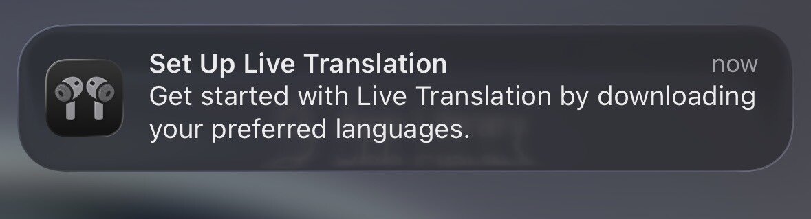 A notification prompts the user to set up live translation by downloading preferred languages.