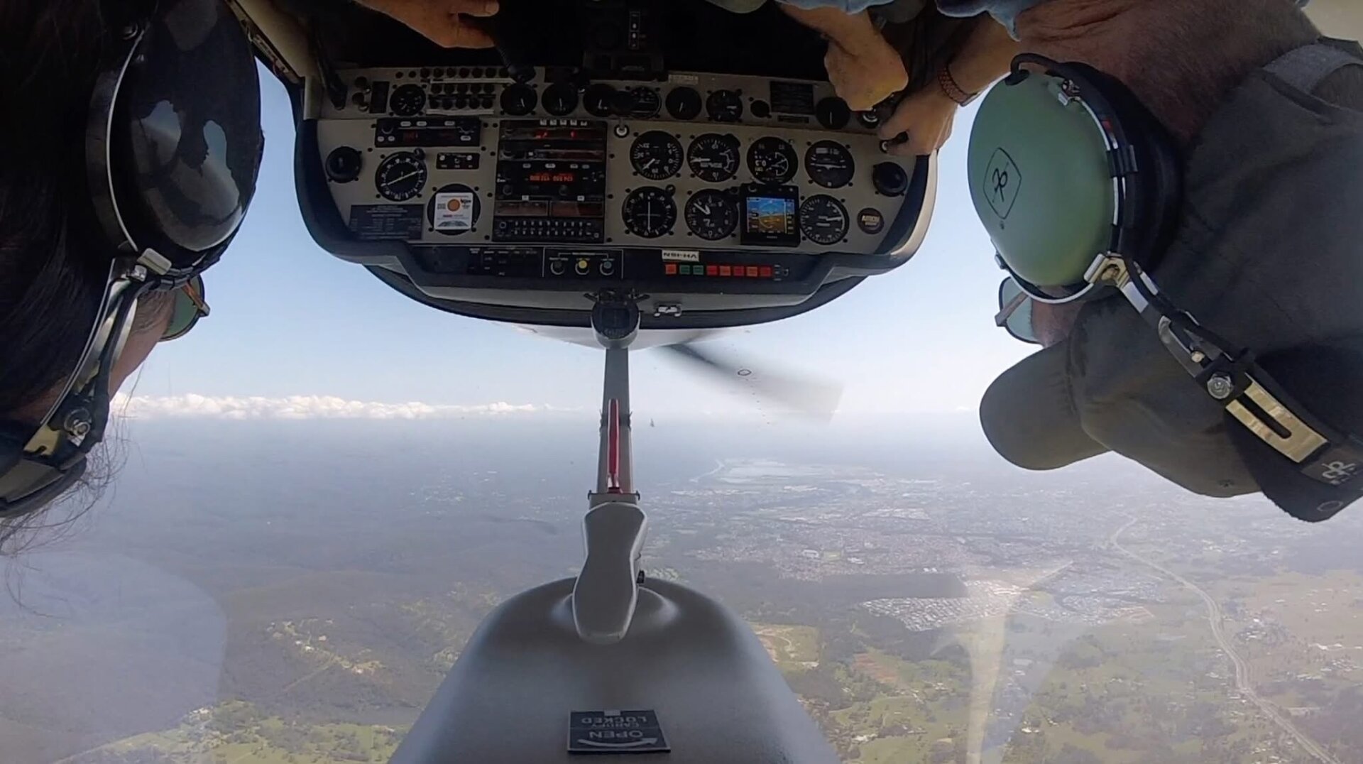 A photo from the cockpit of an inverted aerobatic plane