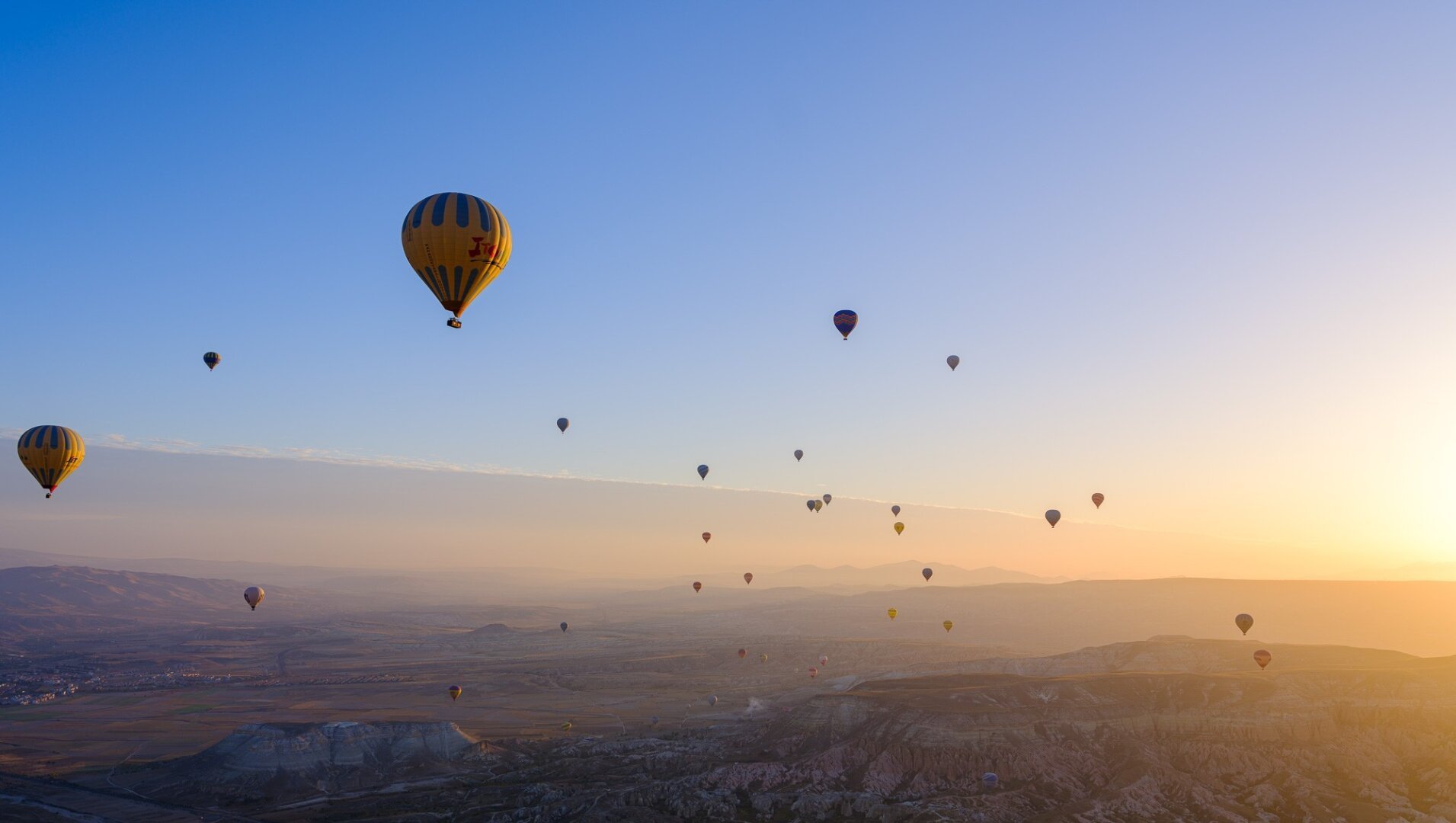 Balloons flying at sunrise over Cappadocia Turkey