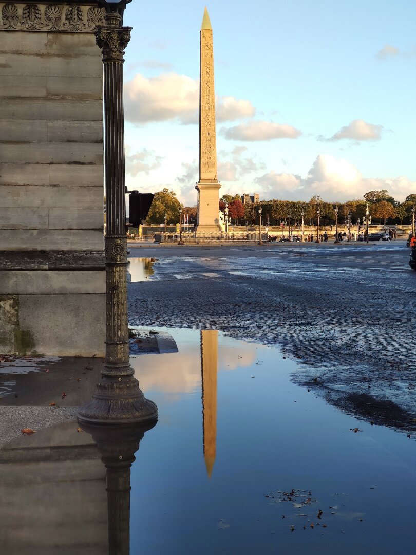 Luxor obelisk and its reflection in a pool of water