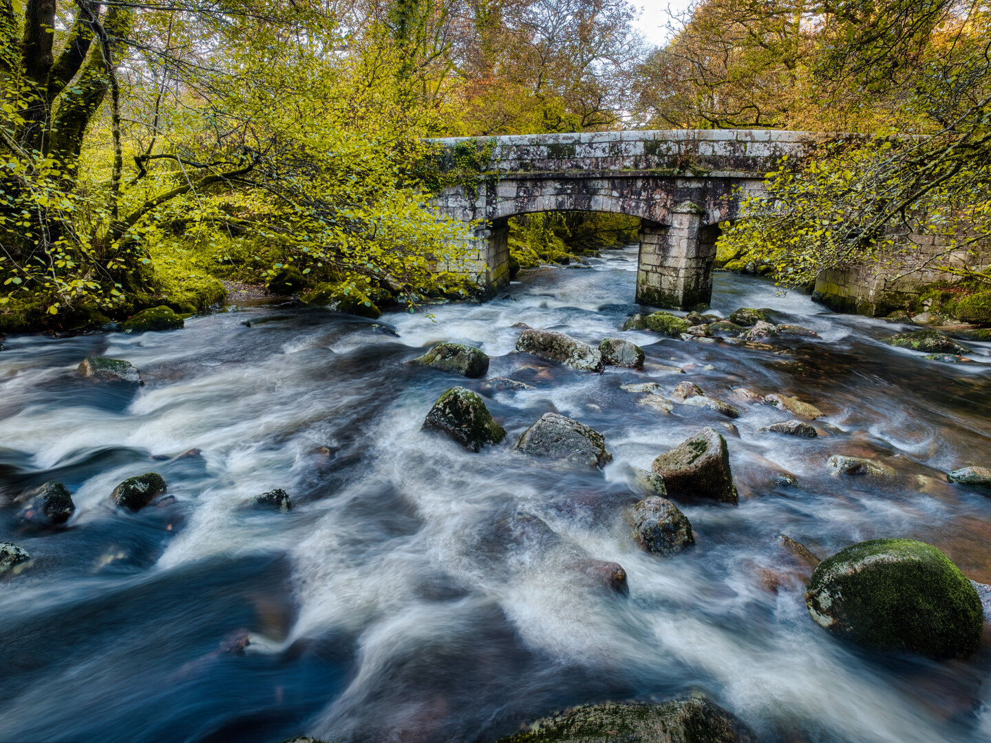 Bridge over a river in Autum