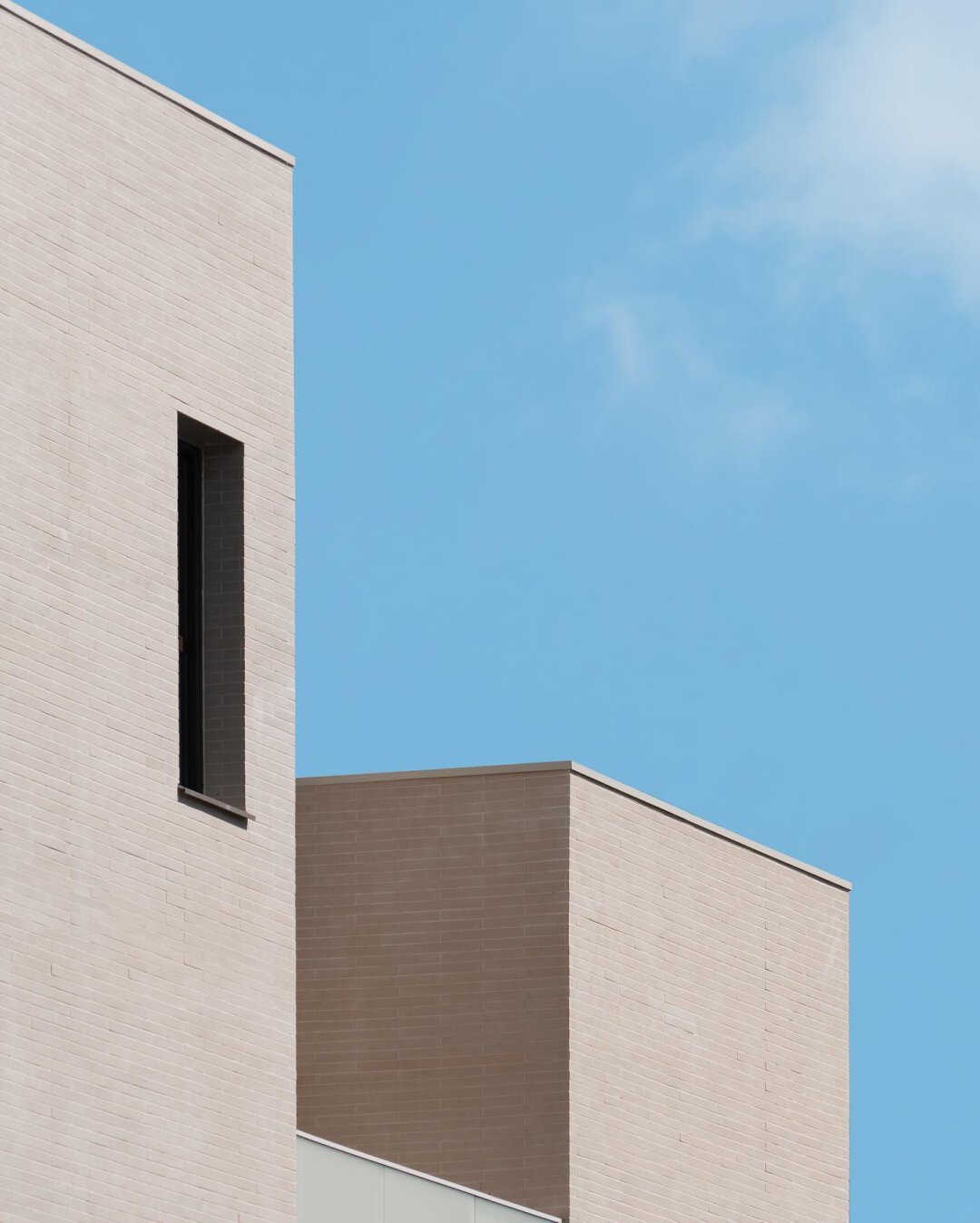 Architecture details, minimalist mood, contrasted textures and blue sky in the background