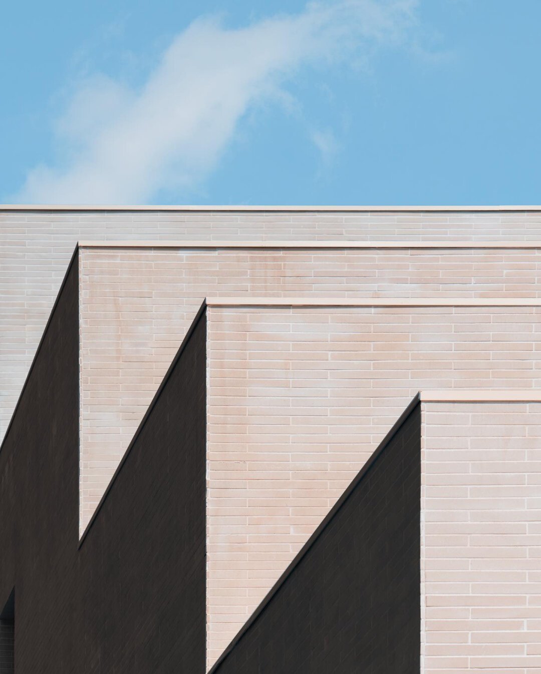 Architecture details, minimalist mood, contrasted textures and blue sky in the background