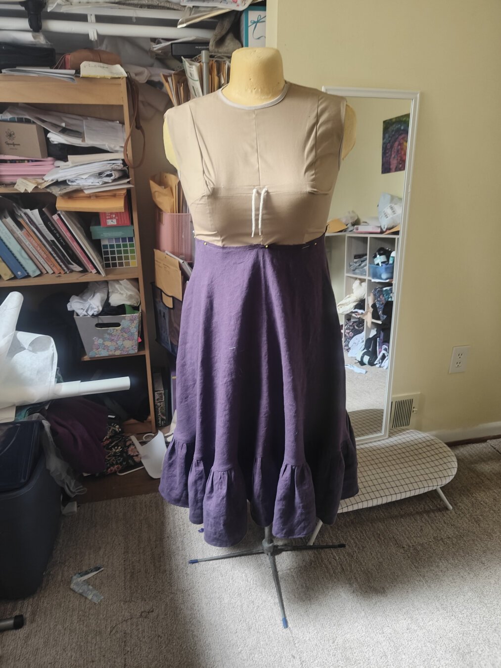 A muted plum linen skirt on a dressmaker's mannequin