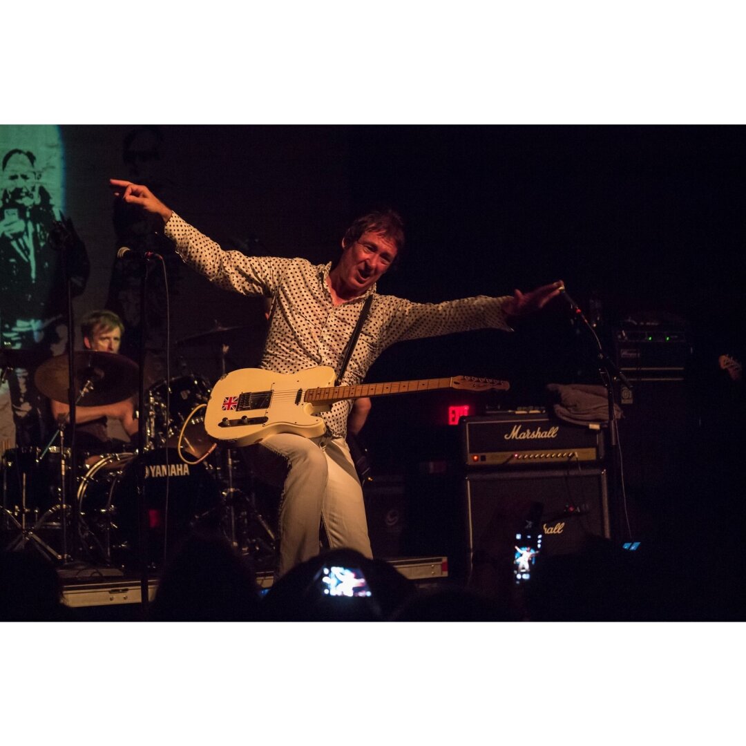 Steve Diggle striking a pose with his guitar during a BuzzCocks show at the Union Transfer in Philadelphia