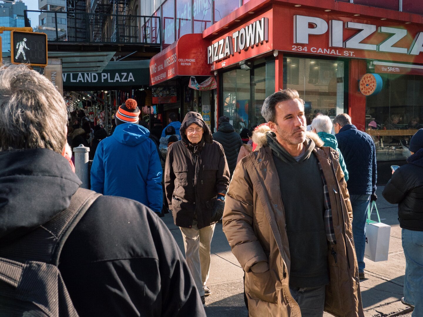 People crossing a busy intersection in Manhattan