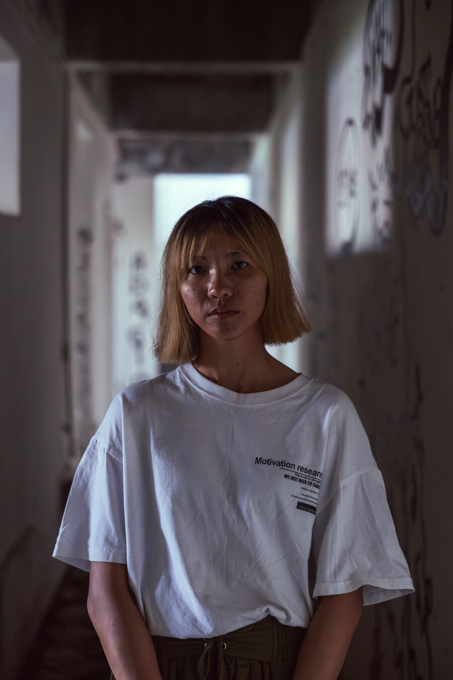 Close-up portrait of a person looking at the camera in natural lighting