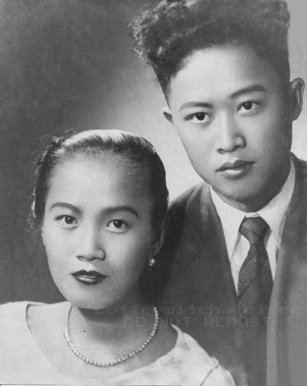 A black and white photo of my grandparents after I restored it