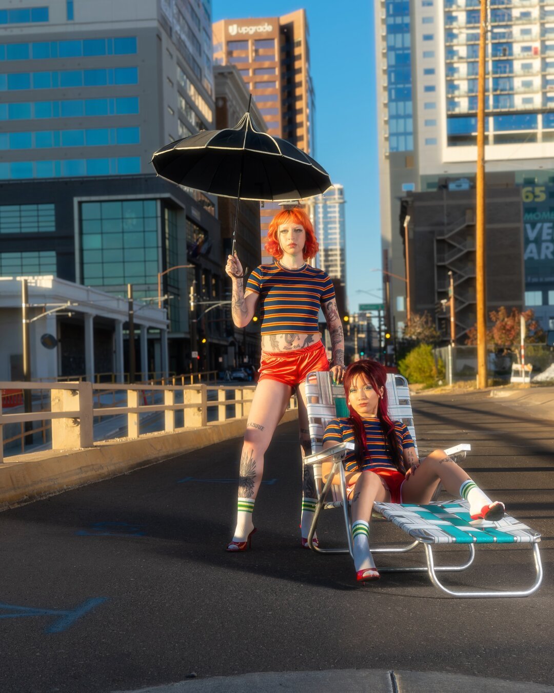 Twins standing and modeling