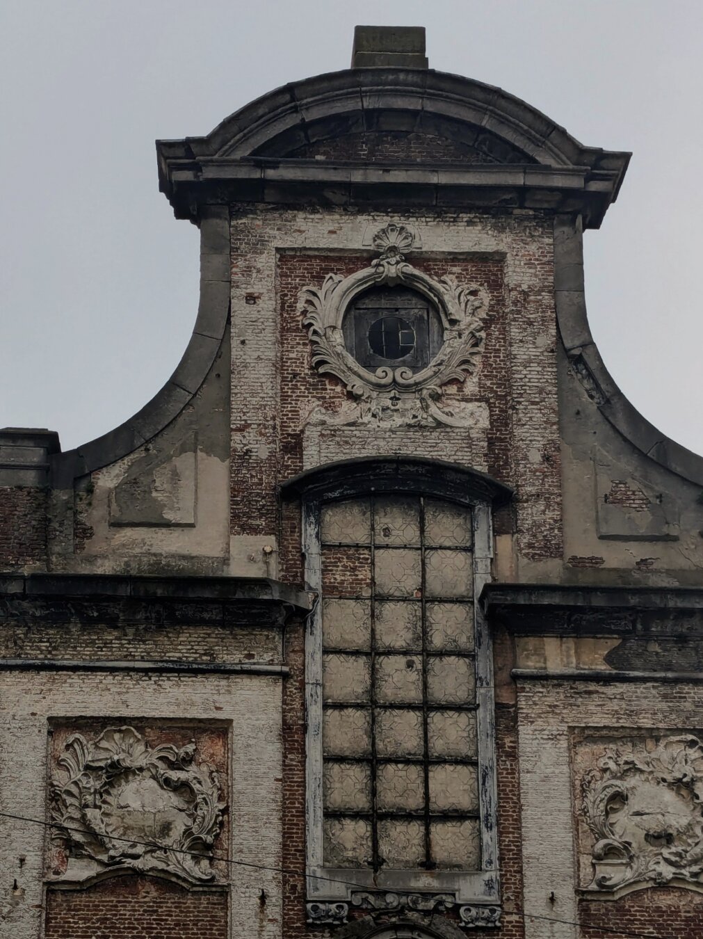 Facade of a medieval building, run down
