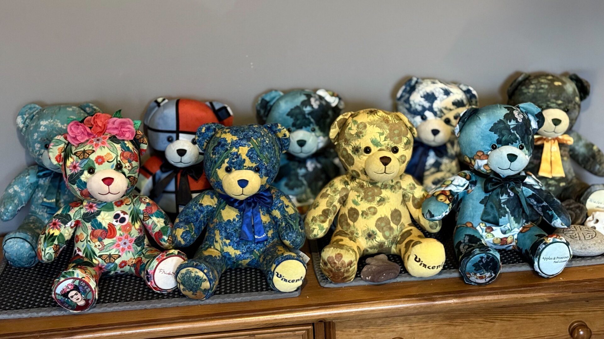 Two rows of Build-a-Bears designed around famous artists' paintings.