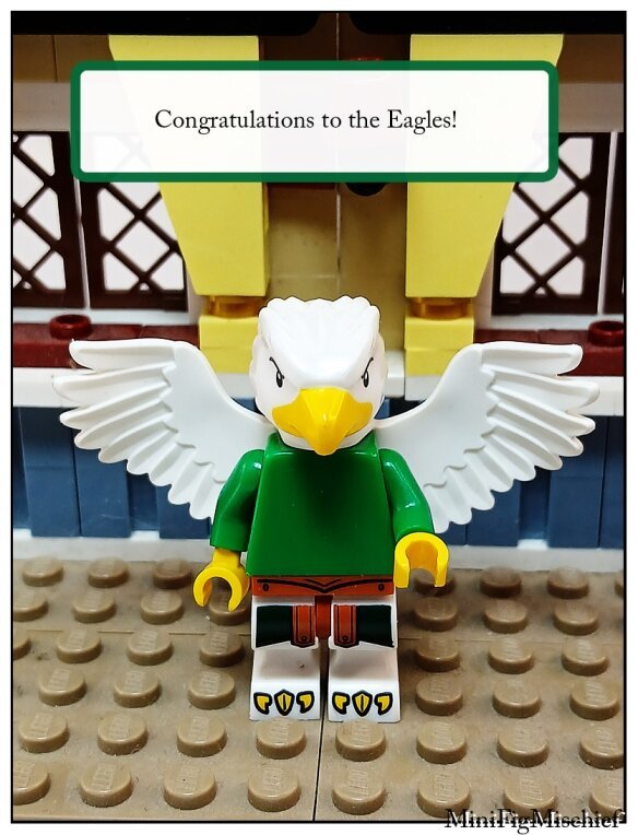 LEGO minifig with an eagle head, wings, and legs. He's wearing a green shirt.