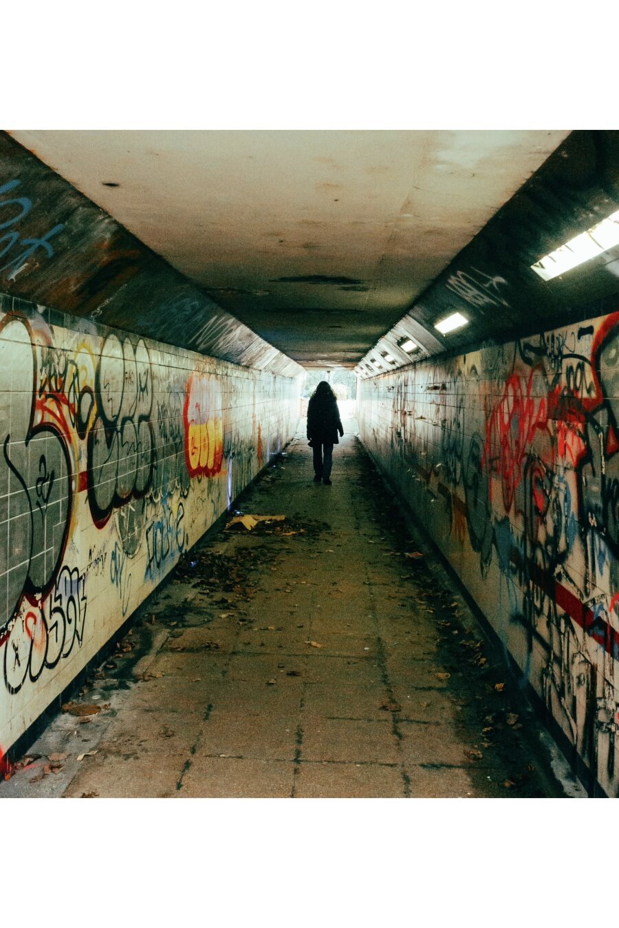 Man walks through underpass