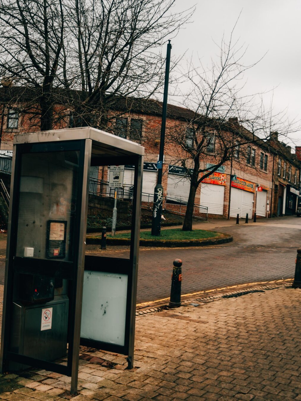 Phone booth in abandoned street