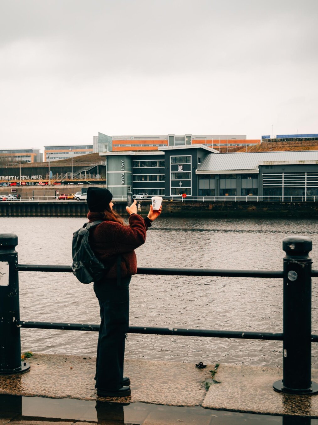 Woman takes photo of coffee cup