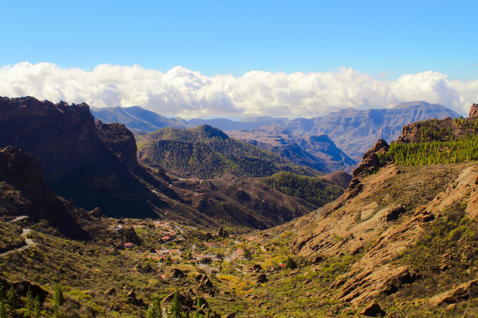 Photograph of the ravine of Ayacata from the road to the Roque Nublo, in the deep of the ravine you can see the village of Ayacata and extending in the distance several mountains.

Photography, landscape, landscape photography, nature, ravine, mountains, beauty, nature lover, canon, canary islands