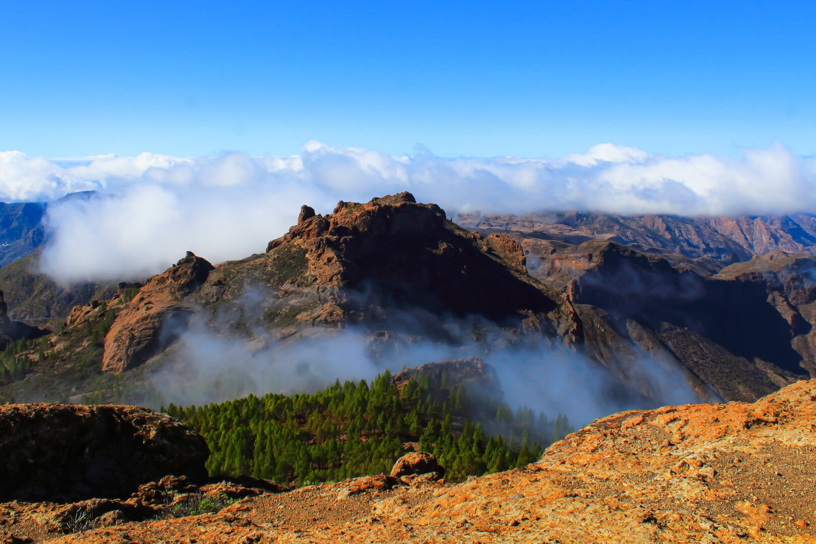 Photograph of the views from the plateau of the roque nublo, in Gran Canaria, mountains can be seen in the distance surrounded by the sea of clouds.

Photography, landscape, landscape photography, plateau, mountain, gran canaria, clouds, canon, beauty, canary islands.