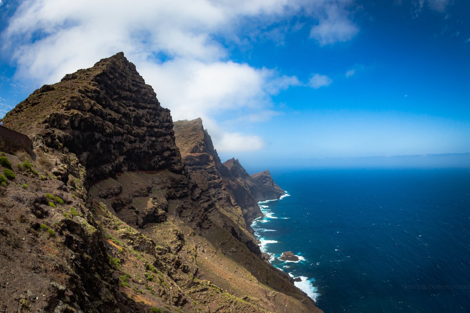 Photograph of “la cola del dragon” in the north of Gran Canaria, a formation of mountains that seems to form a dragon's tail over the ocean.

Photography, landscape photography, mountain, ocean, gran canaria, island, sky, mountain range, canary islands, 10mm, canon, beauty, viewpoint.
