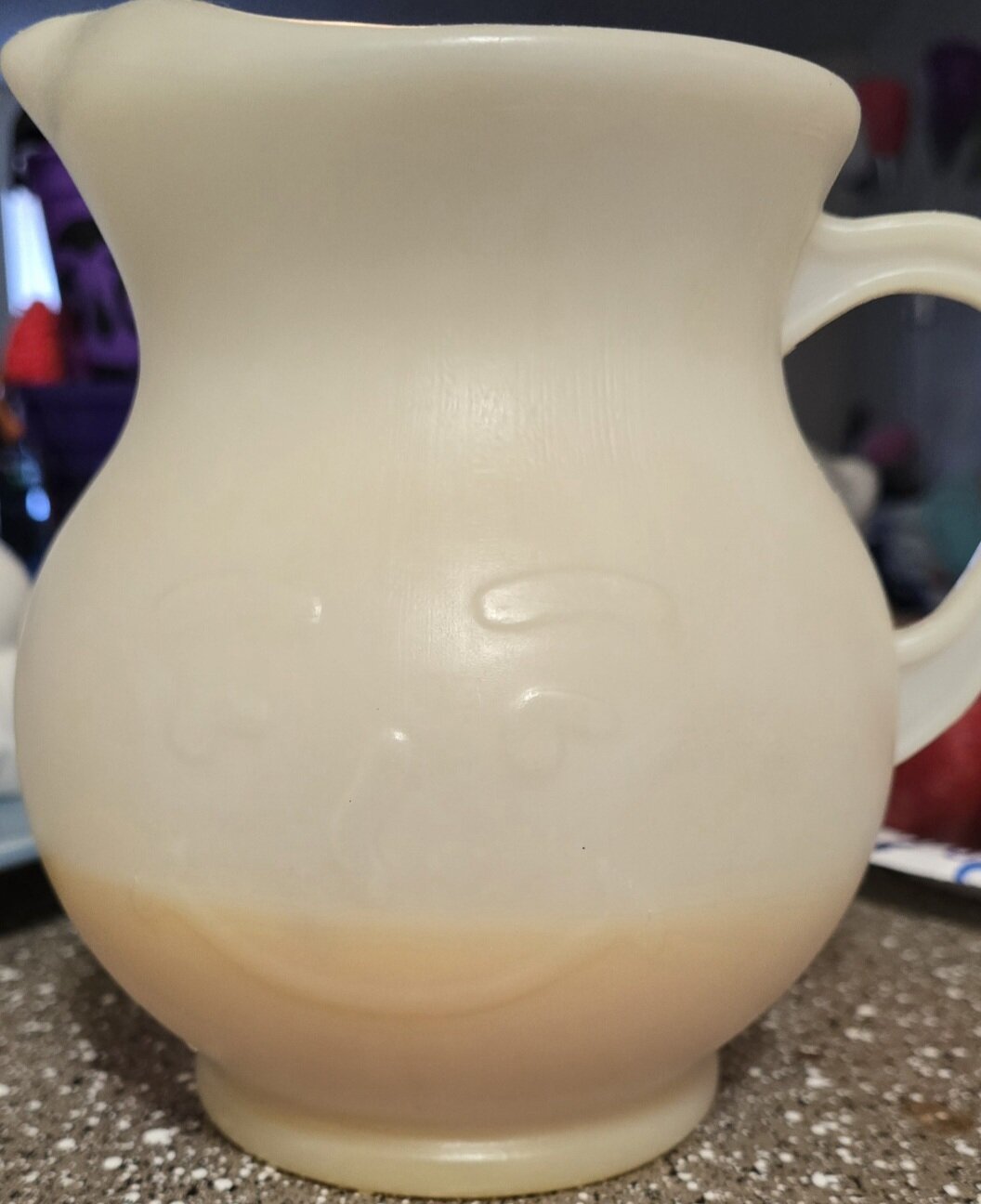 Kool-aid man pitcher with orange juice inside