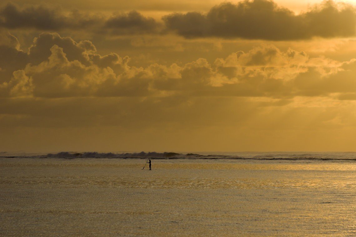 Paddleboarding at sunset