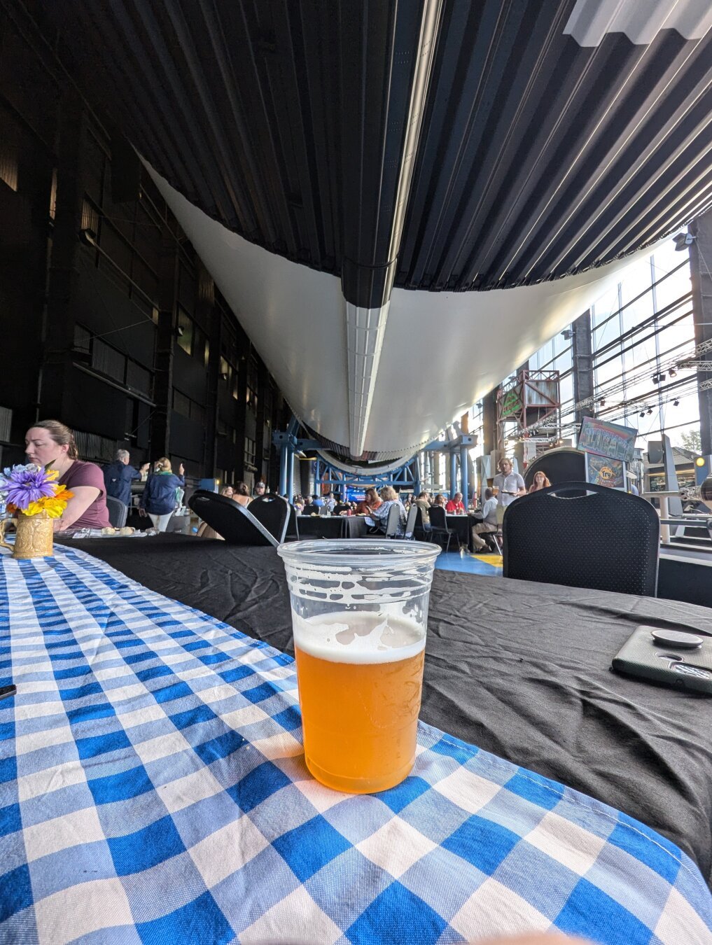 Enjoying a cold beer under the Saturn V rocket at the Davison center of the space and rocket center in Huntsville Alabama