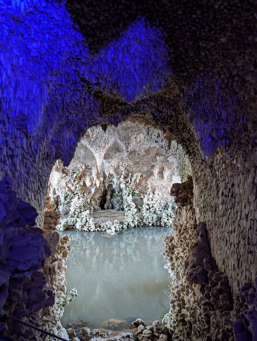 Inside of a grotto looking out onto water