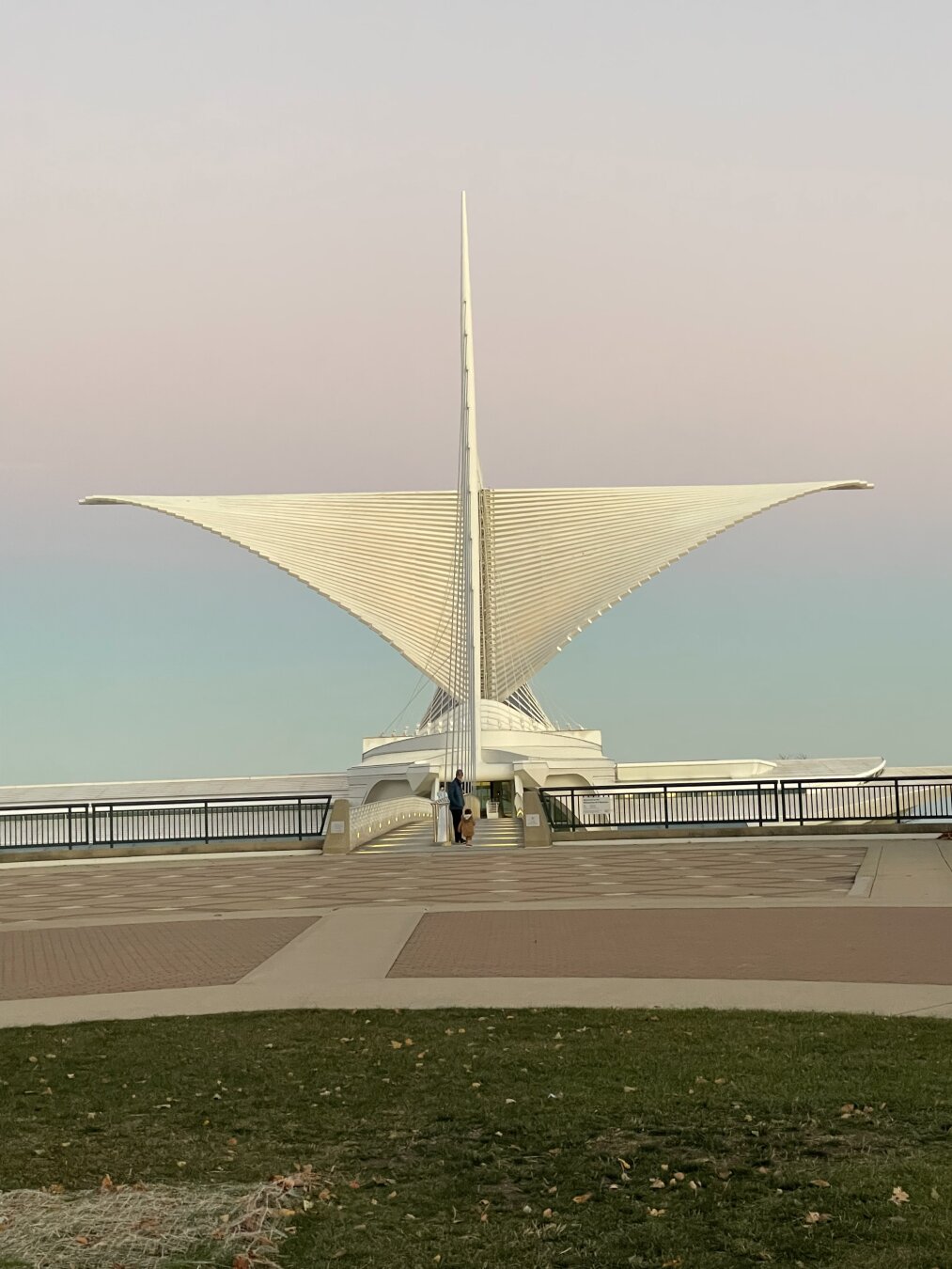 Milwaukee Art Museum shot with purple sky above museum wings and blue sky below.