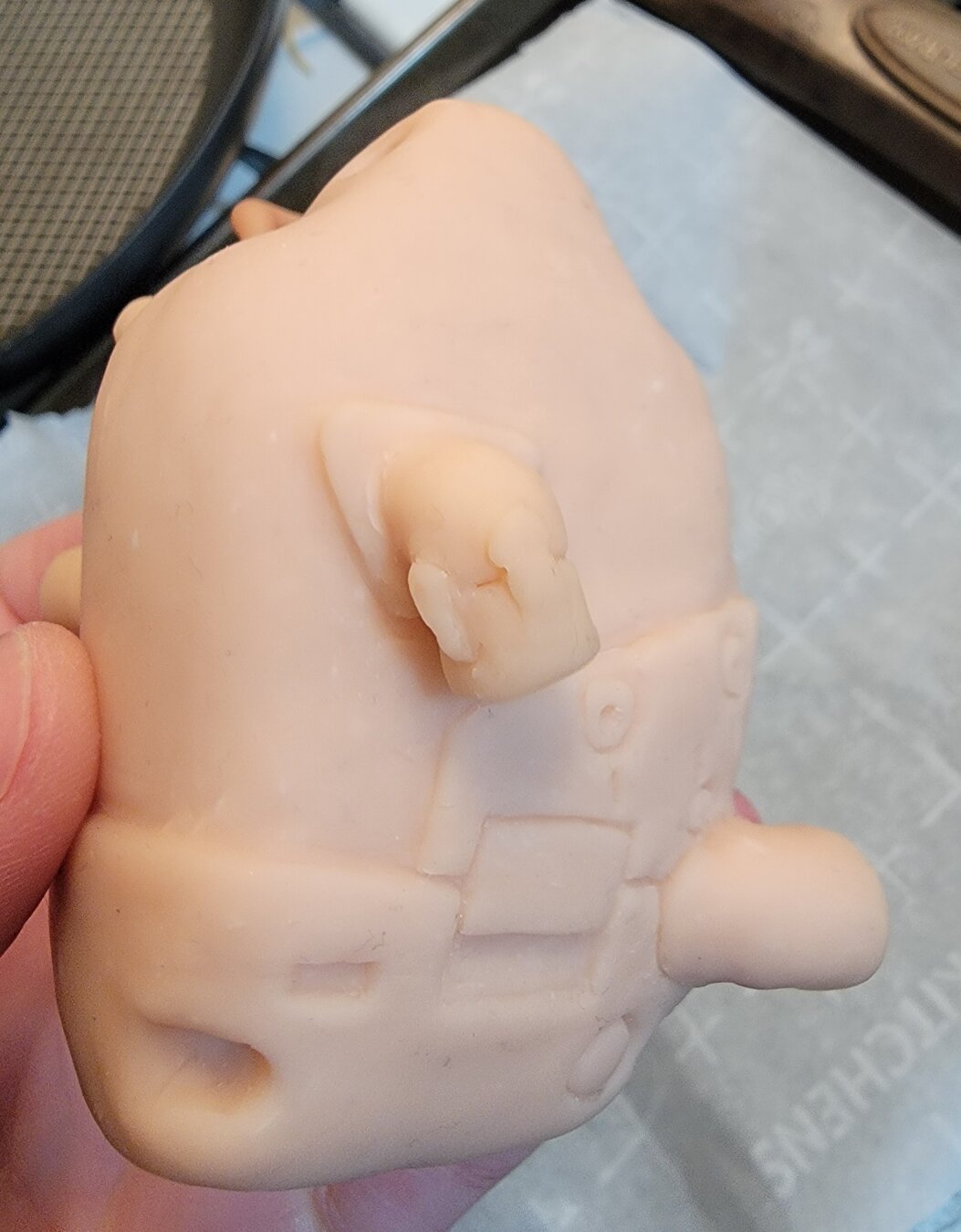 Slightly closer, angled shot of the front to show the tiny levers sculpted onto one of the valve pipes.