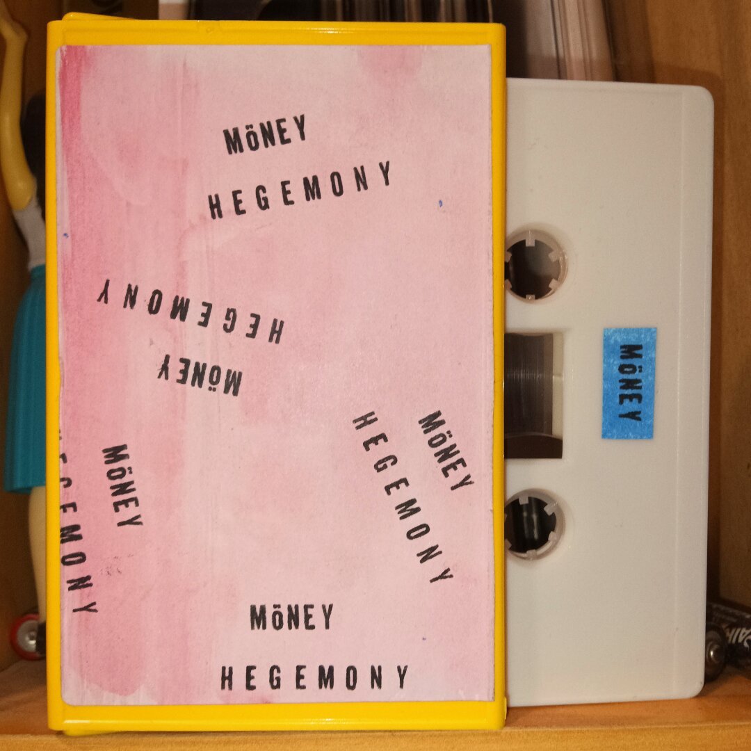 Cassette de MÖNEY - HEGEMONY
portada rosa con letras en negro sin más 

MÖNEY cassette - HEGEMONY
pink cover with black letters without further ado