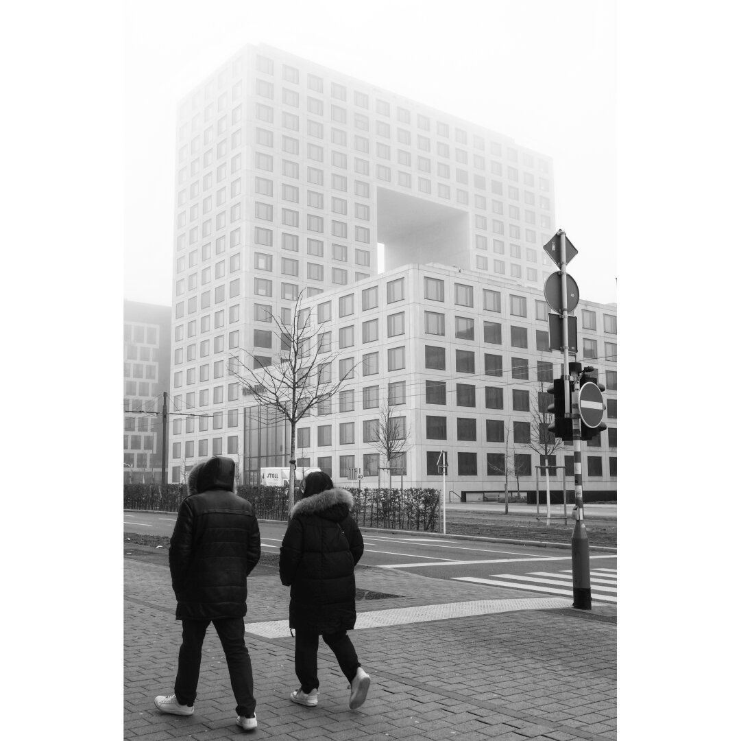 D-square building from the Boulevard Kockelscheuer in the fog with two guys from the back.