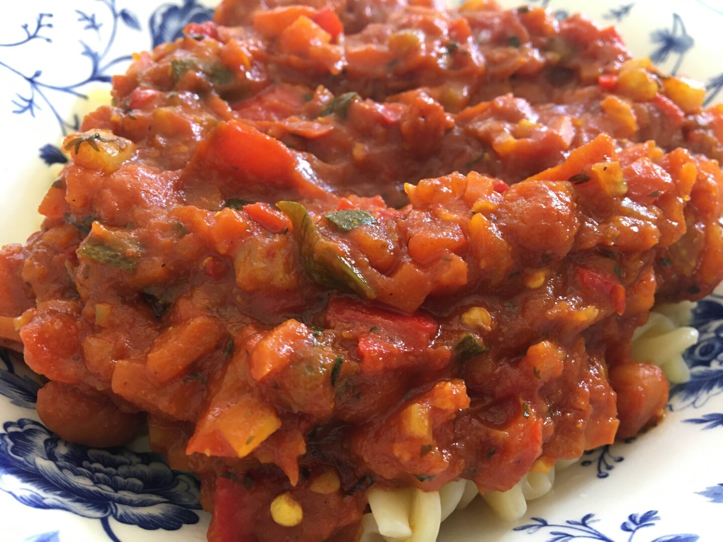 Tomato sauce with veggies together with fusilli (close-up)