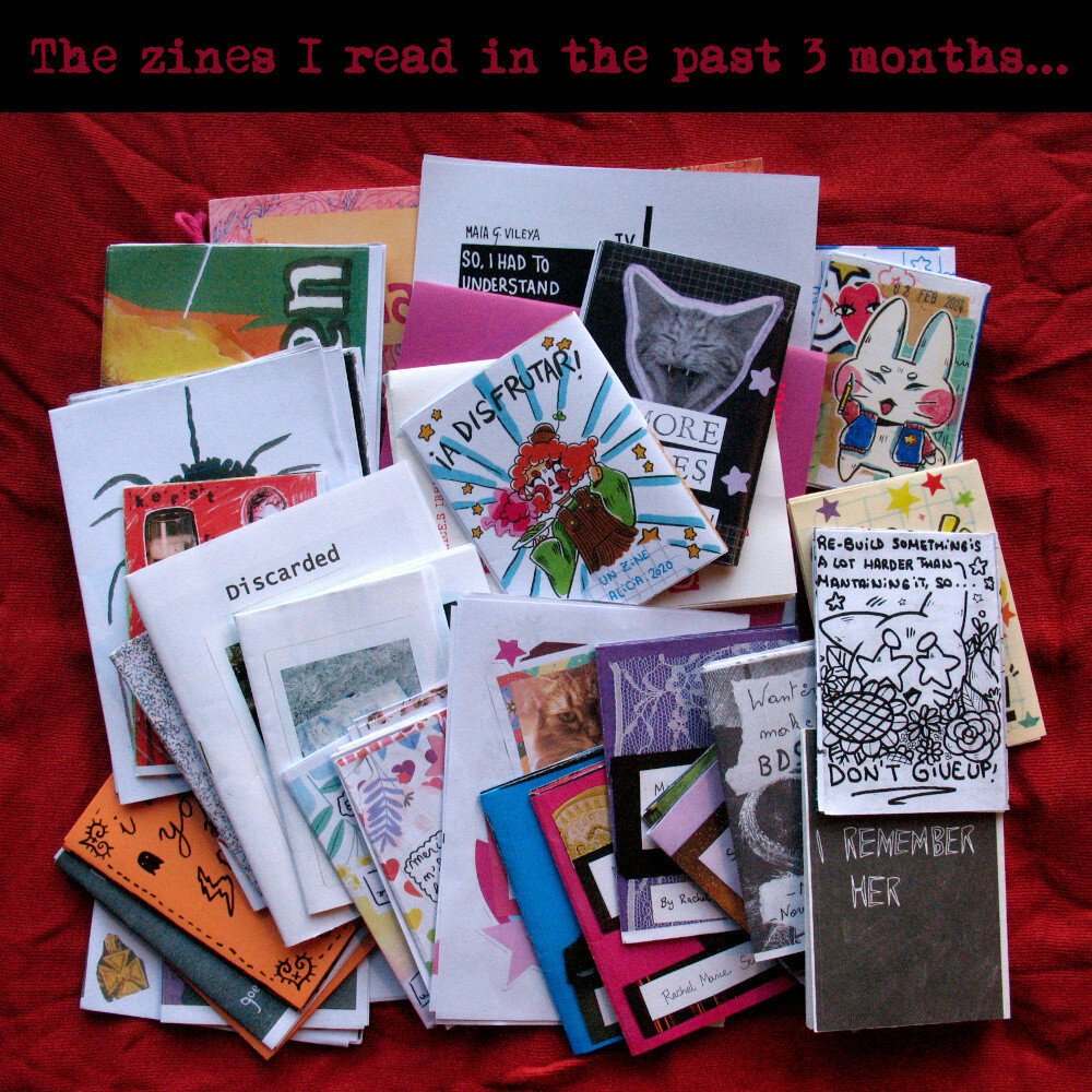 Stack of colourful zines on red cloth. Text says: The zines I read in the past 3 months.