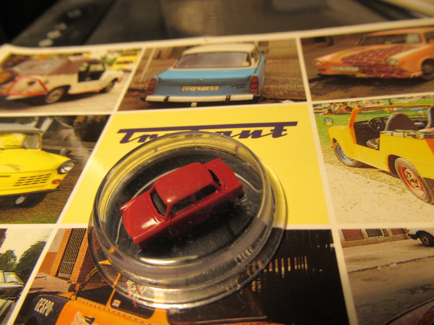 Postcard. In the middle a small Trabant, toy.