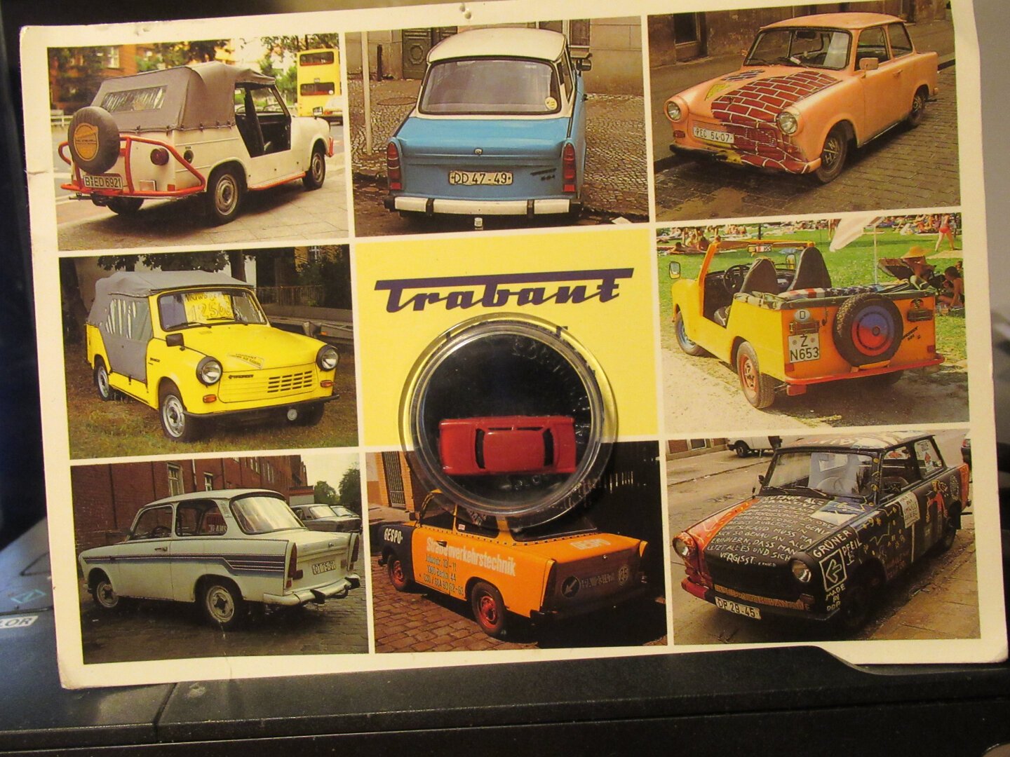 Postcard, In the middle a small Trabant toy car.
