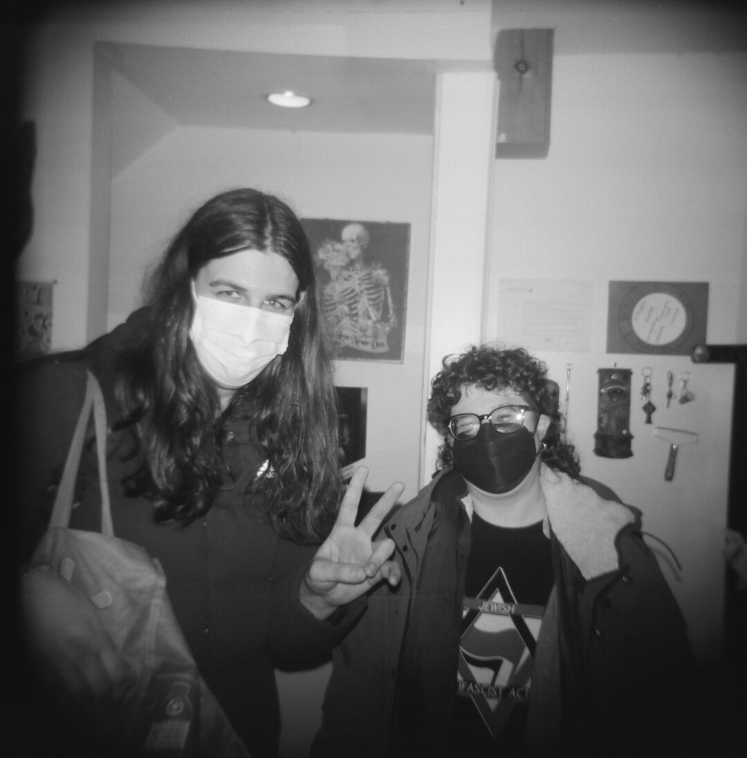 emily and rach posing for me inside the arcade. holga 120cfn kentmere 400