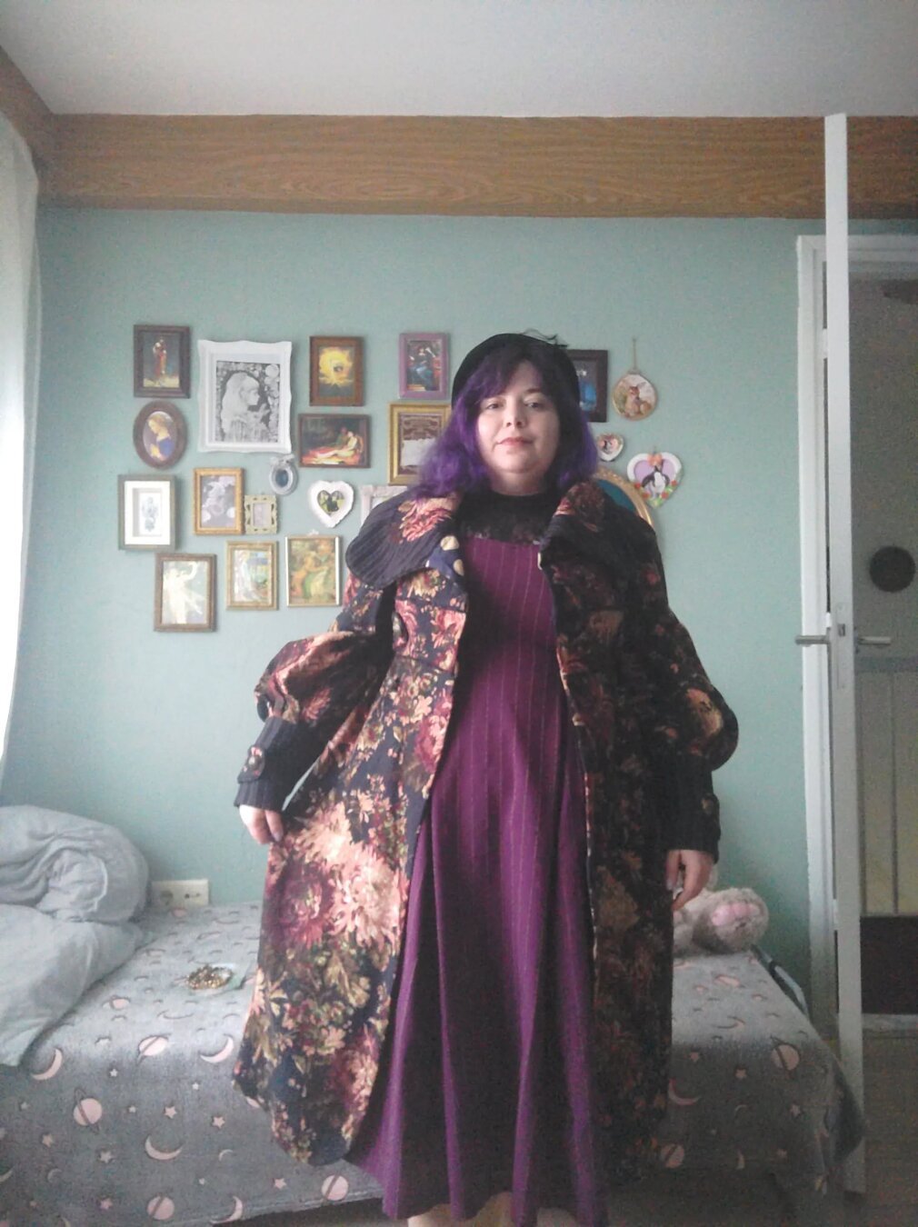 Plus size woman wearing handmade purple dress and thirfted coat