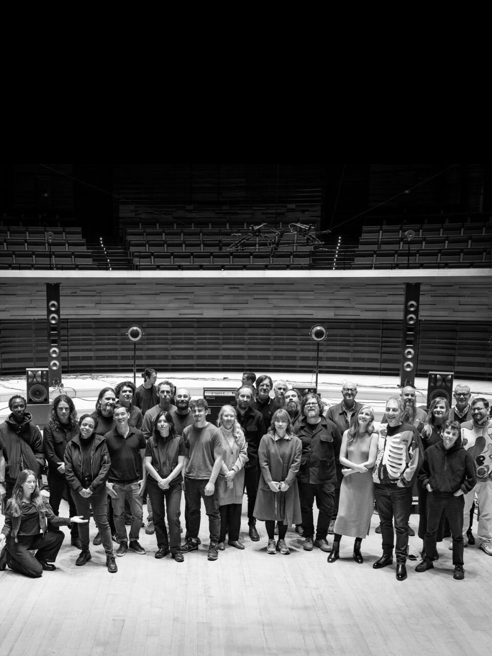 A group photo of the artists performing at Presence electronique 2024, taken in the Auditorium of Radio France.