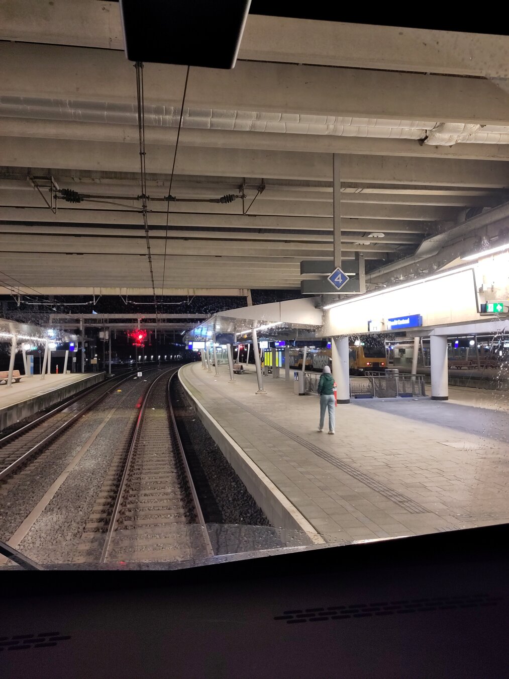Top: scene from The Shining where Wendy Torrance locked herself up in the bathroom and Jack puts an axe through the door, only the axe has been replaced by a microphone. Bottom: Through the crack in the door, Mariah Cary is singing 'All I want for Christmas'