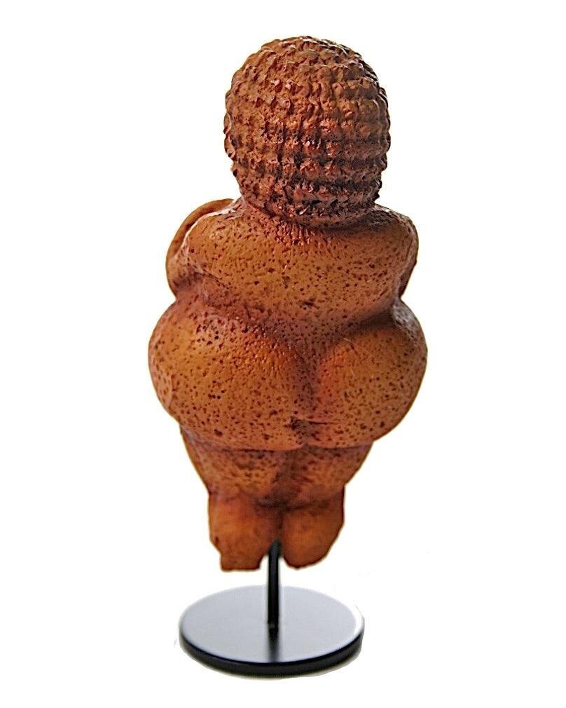 Venus of Willendorf. A 30,000 year old carving of a curvaceous female figure. The view is of her back. She has dumpy little legs, and a pronounced bum, much like the amigurumi in the previous picture.